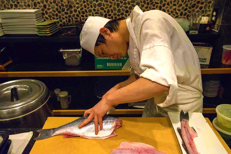 Chef slicing fish